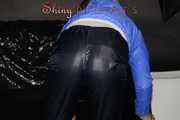 Sexy Sandra wearing a supersexy black shiny nylon rain pants and a sexy shiny blue rain jacket lolling on the sofa (Pics)