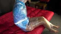 Watching sexy Pia being envelopped in film wearing a sexy blue shiny nylon shorts and a lightblue shiny nylon rainjacket (Video)