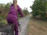 Get a Video with Sandra riding her bike enjoying her shiny nylon Rainwear
