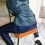 Marlin tied and gagged in a shiny blue rainsuit