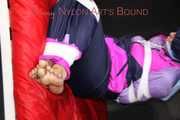 Watching Pia wearing blue/pink shiny nylon rainwear being tied and gagged and hooded with tape and a clothgag (Pics)