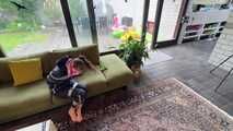Rachel Adams bound and gagged by an Intruder in shiny Rainwear