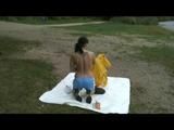 Being with Enni sitting at a lake wearing sexy shiny nylon rainwear (Video)