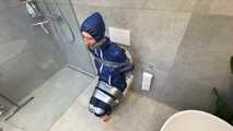 Myxxxy surprised by an Intruder in her Bathroom finally bound and gagged in Rainwear