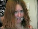 24 Yr OLD CRAFTER IS CLEAVE GAGGED, MOUTH STUFFED, HAND GAGGED, OTM GAGGED & TIED TO A CHAIR (D55-6)