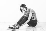 Mia in purple sneakers and cuffs