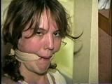 SWEET SHY HEATHER IS MOUTH STUFFED, ACE BANDAGE CLEAVE GAGGED, BAREFOOT, TOES TIED AND BOUND TO A CHAIR (D46-13)