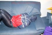 Jill tied, gagged and double hooded on a sofa wearing supersexy oldschool rainwear (Pics)