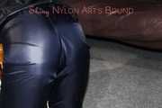 Watching sexy Sandra wearing a sexy blue shiny nylon pants and a rain jacket being tied and gagged with ropes and a clothgag on a stool (Pics)