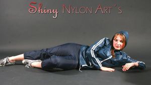 Anastasia posing in a foto studio wearing supersexy blue rainwear (Pics)
