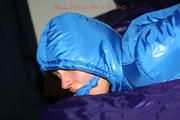 Alina tied and gagged in a shiny skisuit