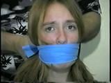 24 Yr OLD CRAFTER IS CLEAVE GAGGED, MOUTH STUFFED, HAND GAGGED, OTM GAGGED & TIED TO A CHAIR (D55-6)