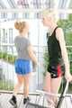 Jenny and a friend of her sitting on the balcony with eachother wearing sexy shiny nylon shorts ans tops (Pics)