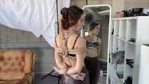 Rey Sanson bound and gagged in a shiny Downcoat