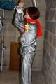 Nicole in an silver shiny PVC sauna suit tied and gagged in an cellar (Pics)