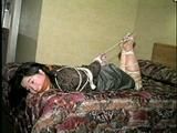 25 YEAR OLD ASIAN MAI-LING IS MOUTH STUFFED, CLEAVE GAGGED, WEARING GLASSES, HOG-TIED, WEARING PANTYHOSE WITH TOES & FEET TIED (D50-4)
