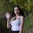 Beautiful girl from Russia smoking two cigarettes outside