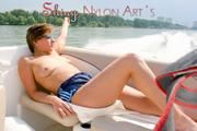 Stella and Leonie on a boat wearing sexy shiny nylon shorts and bikini tops (Pics)