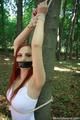 Nelly tied on a tree