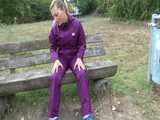 Get a Video with Sandra riding her bike enjoying her shiny nylon Rainwear
