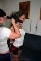 Petra tied and gagged by Jill in shiny shorts