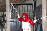 Katharina tied and gagged in a shiny nylon downjacket