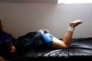 Shelly tied and gagged in shiny nylon shorts
