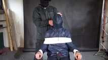 Aiyana in rainwear chairbound, gagged and hooded (and she loved it)