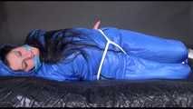 Lucy tied and gagged with ropes on bed wearing sexy blue oldschool downwear (Video)