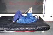 Lucy tied with cuffs overhead and gagged with a clothgag wearing sexy blue rain pants and a raincoat (Pics)