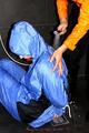 Jill bound and gagged by Simone in shiny nylon rainwear