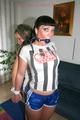 Jill and Petra tied and gagged to eachother in a living room both wearing sexy shiny nylon shorts and a top (Pics)
