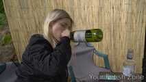 Vanessa is drinking in a hut