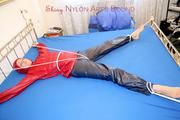 A nice cuty hooded, tied and gagged on bed