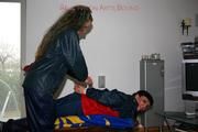 Jill tied and gagged by Petra both in shiny nylon rainsuits