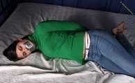 Roxana hogtied on bed