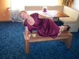 Hogtied on a table 
