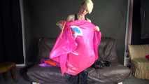 Watching sexy Courtney putting on several shiny nylon rain capes including hoods over a black shiny nylon rain pants (Video)