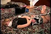 23 YR OLD AIRLINE FLIGHT ATTENDANT IS WRAP BONDAGE TAPE GAGGED, BAREFOOT, TOE-TIED, HOG-TIED, FOOT TICKLED, AND DUCT TAPE TIED STRUGGLING ON THE BED (D73-12)