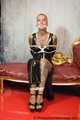 Miss Francine bound and gagged with layers of gags in a sexy PVC dress