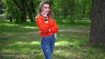Pretty Kate is smoking Marlboro Red 100s in the park