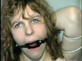 19 Yr OLD SINGLE MOM RONI IS HOME MADE RING GAGGED, HANDS TIED BEHIND HER HEAD & TIED UP SITTING BACKWARDS TO A CHAIR (D50-10)