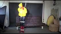 MARA tied and gagged overhead with ropes and a ballgag wearing a super sexy super shiny black rain pants, rubber boots and a yellow down jacket (Video)