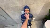 Myxxxy surprised by an Intruder in her Bathroom finally bound and gagged in Rainwear