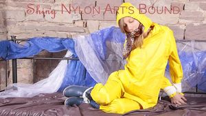 Alina tied, gagged and hooded on a princess bed in an old cellar wearing a shiny yellow rain combination (Pics)