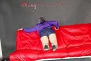 Mara wearing a sexy purple shiny nylon shorts (selfmade) and a rain jacket during preparing her sofa (Pics)