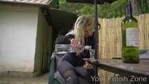 Vanessa is drinking in a hut