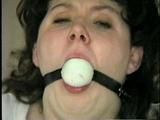 BALL-GAGGED, & TIED BETWEEN  2 PILLARS DAMSEL (D16-12)
