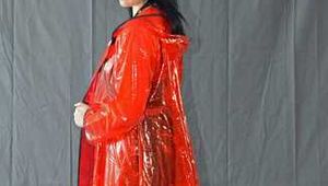 Bound in PVC minidress and red raincoat