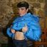 Jill posing in a cooling room wearing a shiny nylon rainpants and a down jacket (Pics)